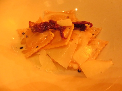 Pumpkin ravioli with slices of manchego and dried tomatoes--earthy and comforting flavors