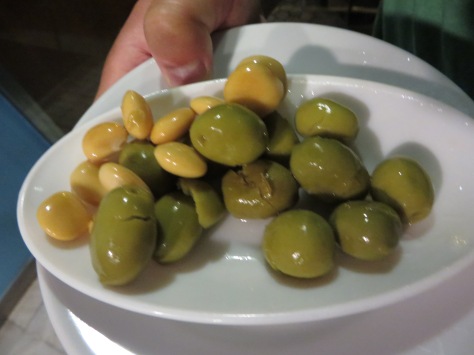It certainly helps to be able to sip on a crisp glass of white wine and munch on olives and almonds while you wait!