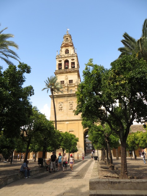 The clock tower located in the corner of the courtyard of La Mezquita